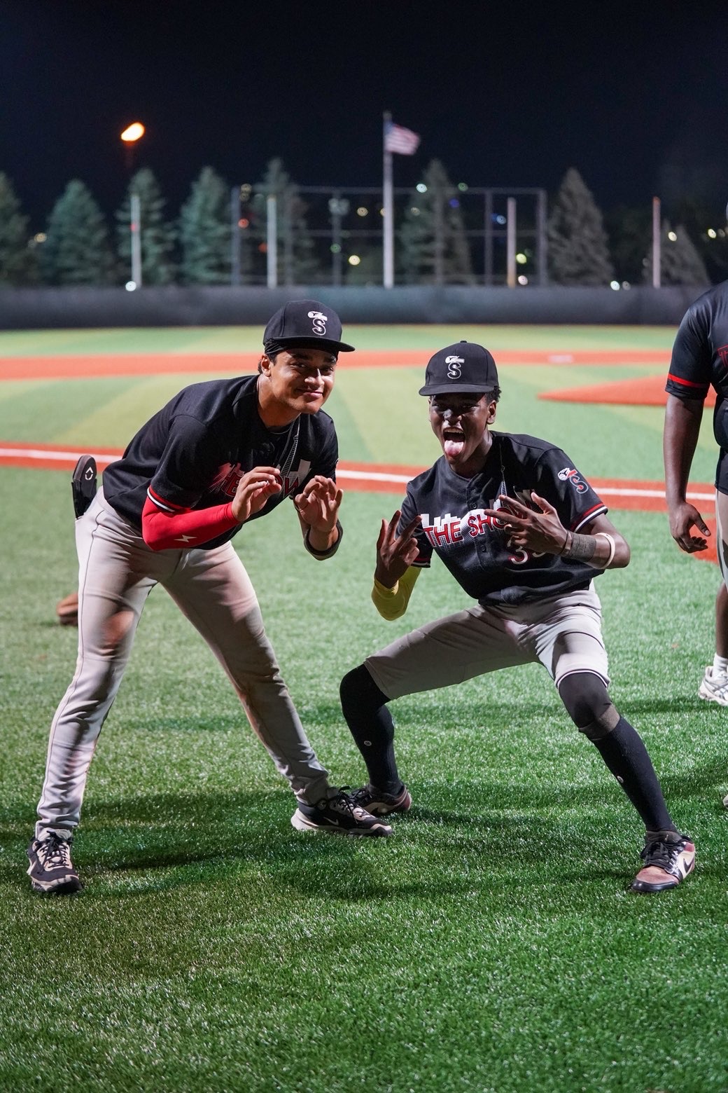 Duane joking with a teammate during a night game with The Show