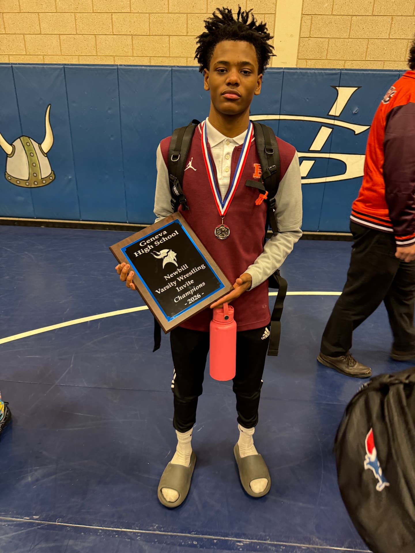 Duane with the Newbill Varsity Wrestling Invite championship plaque